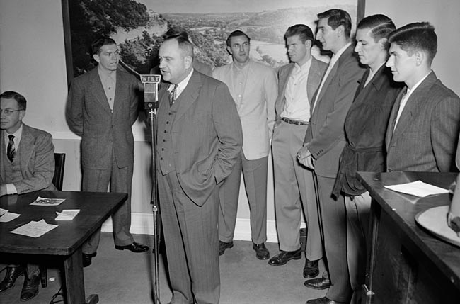 Coach Adolph Rupp and four of his Fabulous Five.