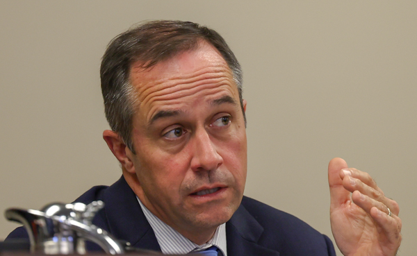 Senator Christian McDaniel speaking and gesturing with his hand to audience
