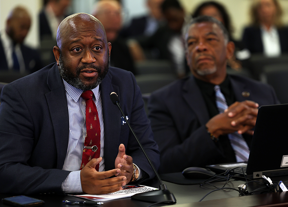 Minority Whip Joshua Watkins at committee Testimony table
